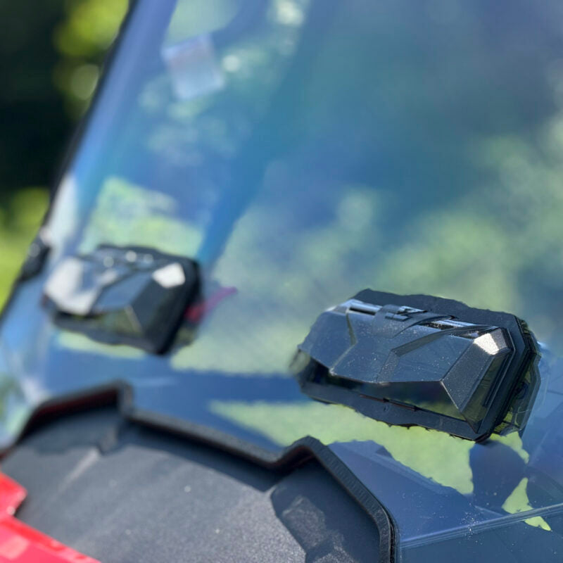 SEIZMIK tool-less UTV windshield made of hard-coated polycarbonate, shown installed on a UTV for protection against elements.