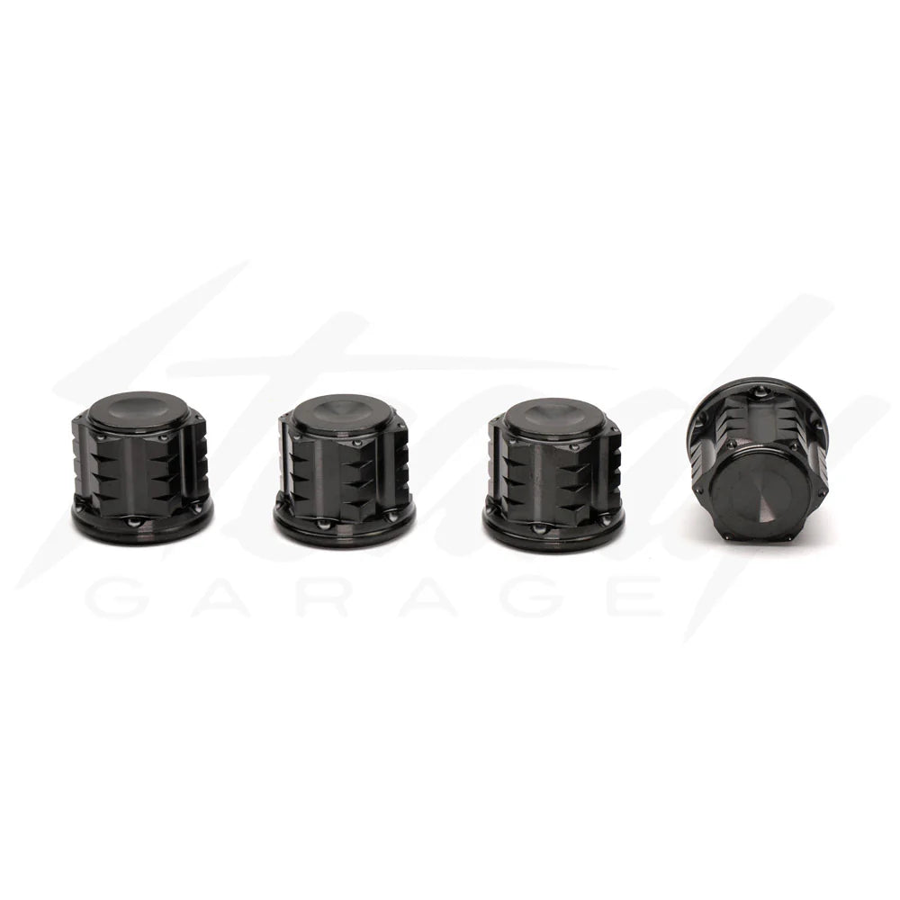 Chimera Engineering closed end titanium M10x1.25 universal nuts for sprockets, wheels, and shocks, shown in a close-up image.