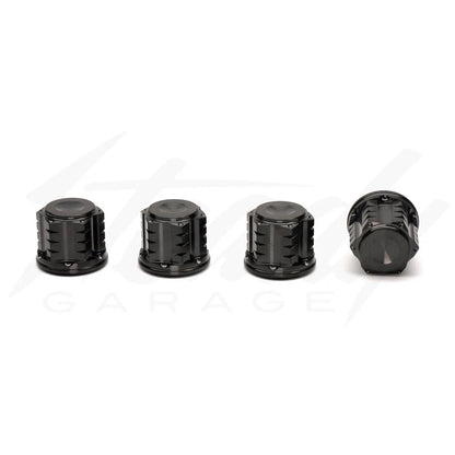 Chimera Engineering closed end titanium M10x1.25 universal nuts for sprockets, wheels, and shocks, shown in a close-up image.