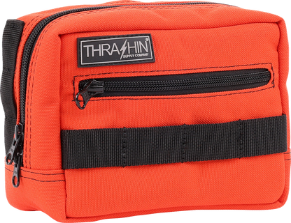 Orange handlebar bag from THRASHIN SUPPLY CO. with durable strap and compact design, ideal for bike storage.