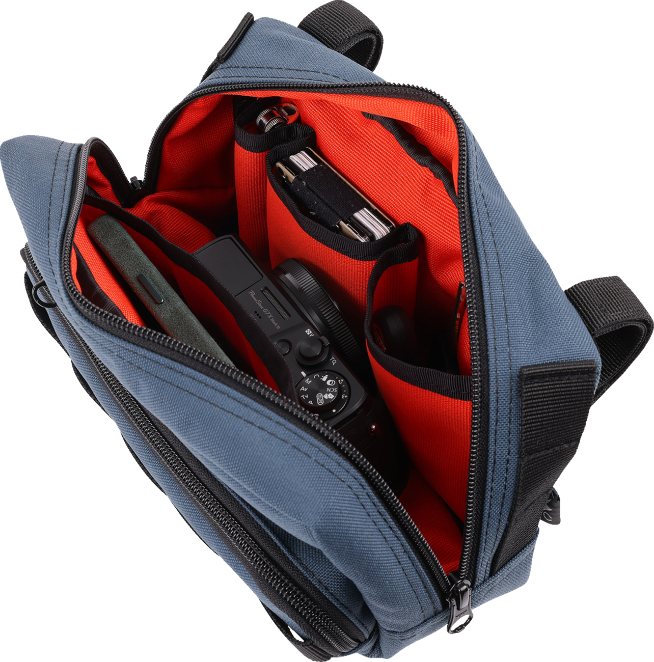 Blue THRASHIN SUPPLY CO. Handlebar Bag Plus mounted on a bicycle handlebar, showcasing its compact, durable design for cycling storage.