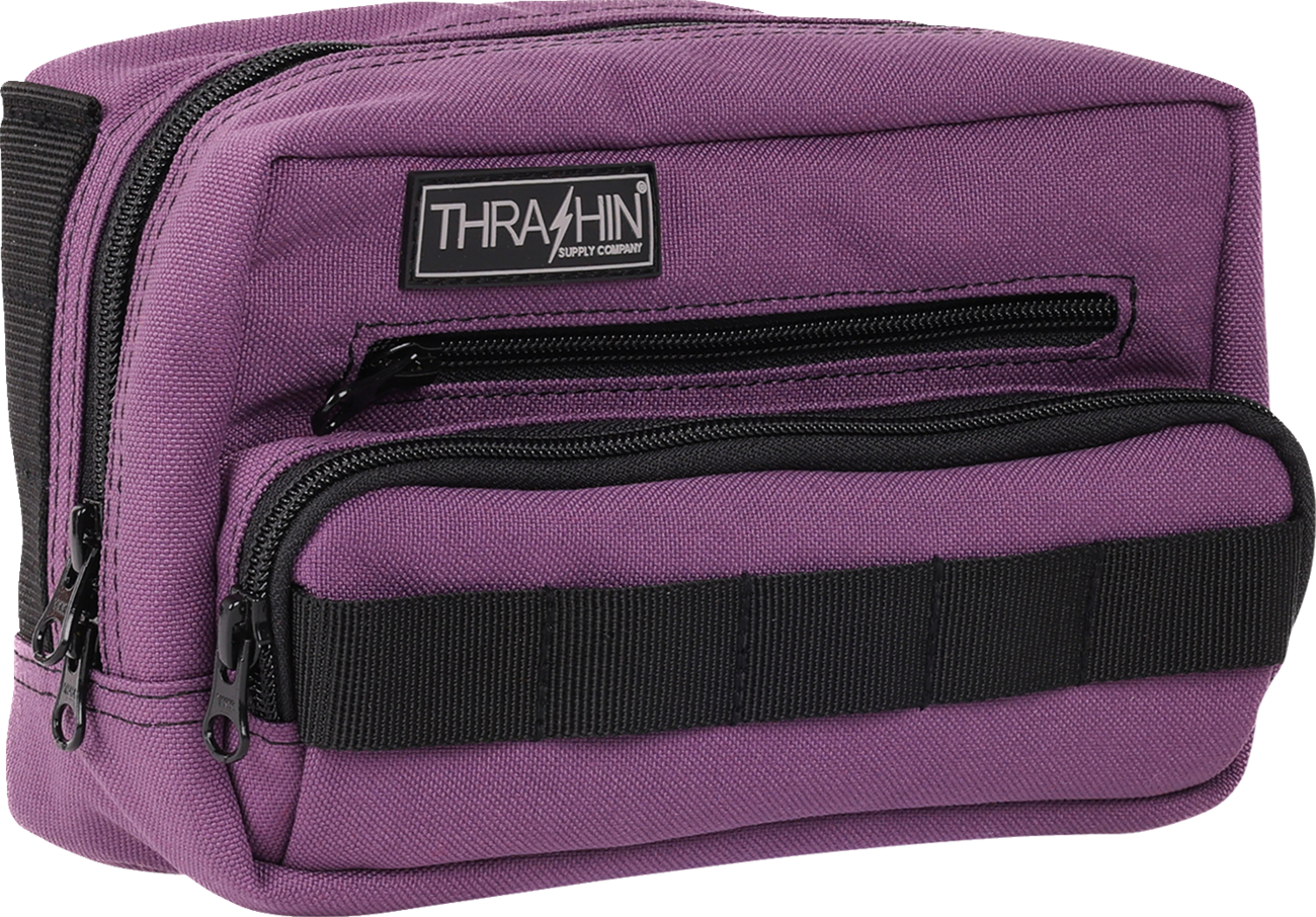 Purple THRASHIN SUPPLY CO. Handlebar Bag Plus mounted on a bicycle handlebar for convenient storage and easy access.