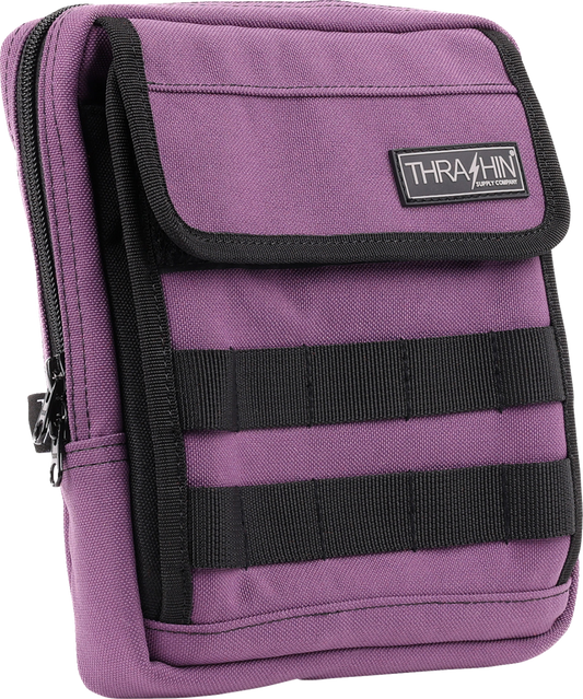 Purple THRASHIN SUPPLY CO. Handlebar Bag Slim mounted on a bicycle handlebar, compact and sleek for cycling gear storage