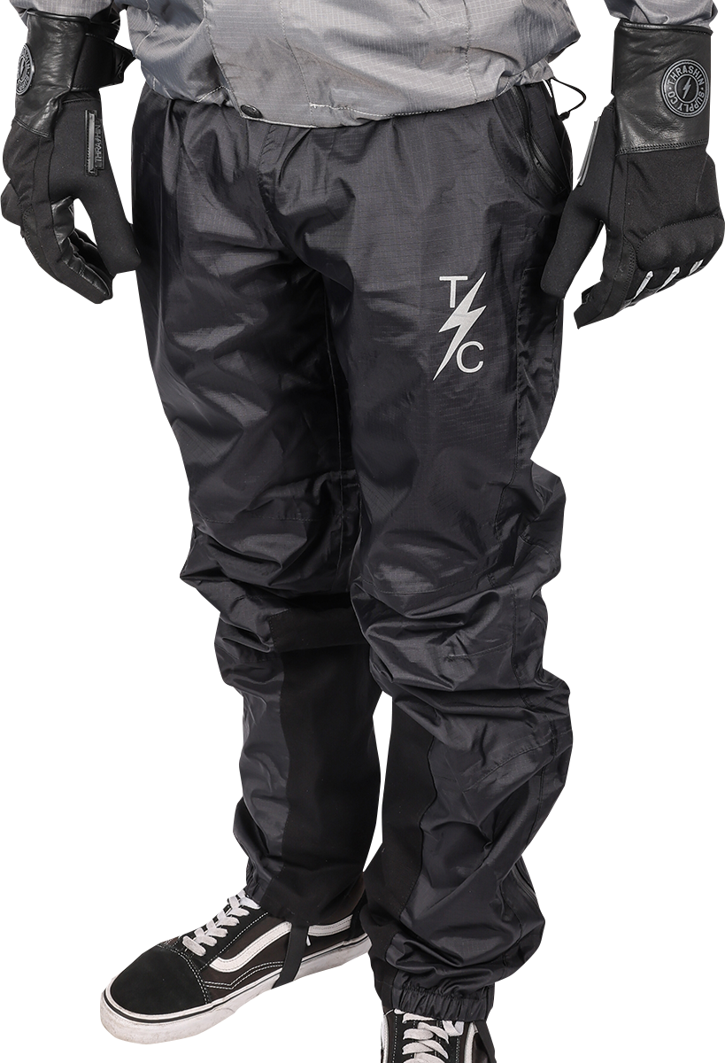 THRASHIN SUPPLY CO. Mission Rain Pants in black, size S/M, shown folded with waistband and waterproof fabric visible.