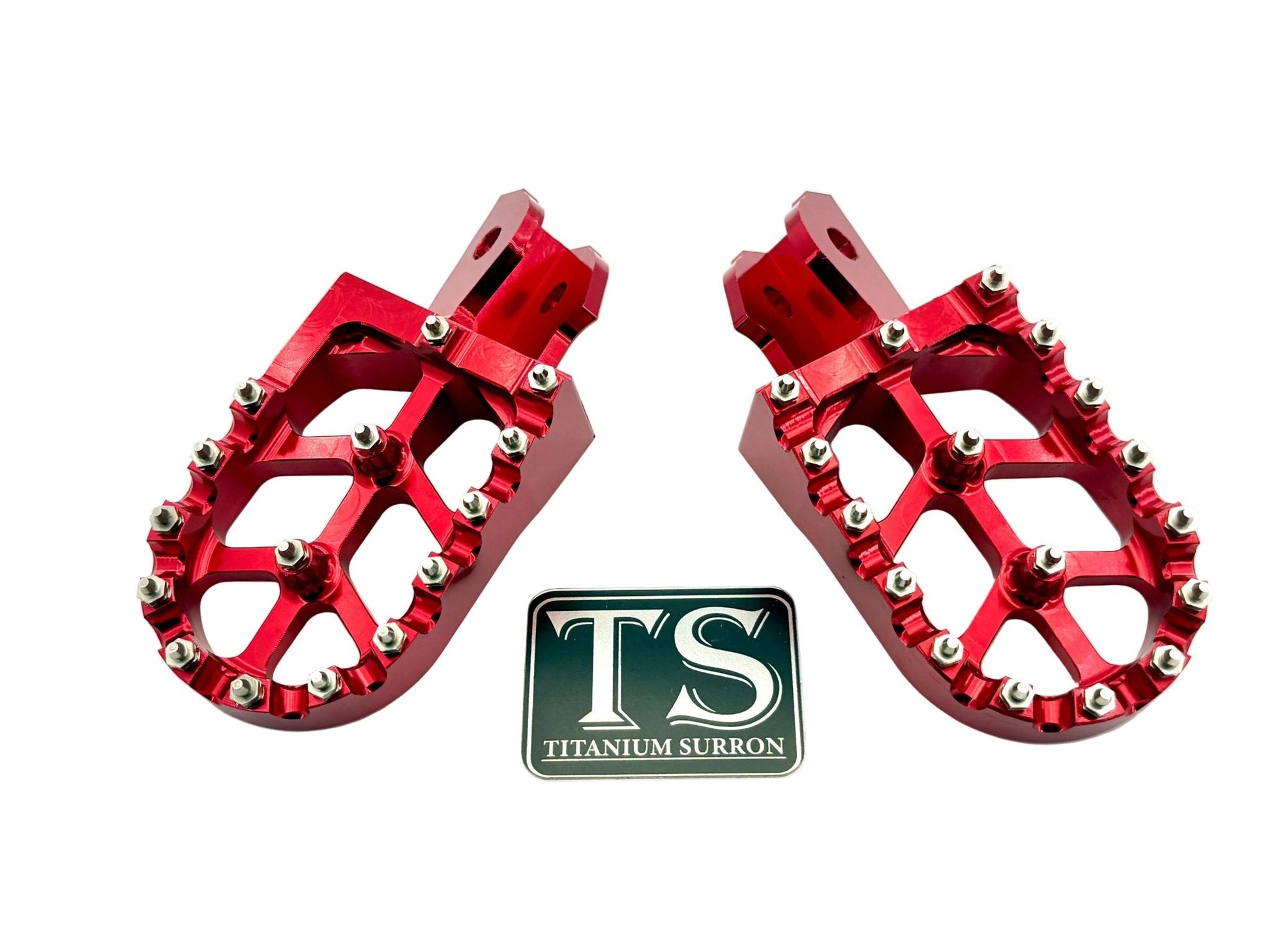 Burnt orange anodized aluminum 6061 TS foot pegs for Surron e-moto, designed by Titanium Surron for durable motorcycle riding.