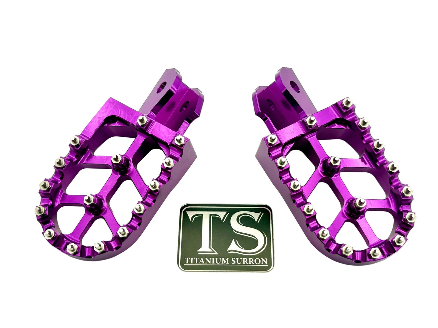 Burnt orange anodized aluminum 6061 TS foot pegs for Surron e-moto by Titanium Surron, designed for durability and style.
