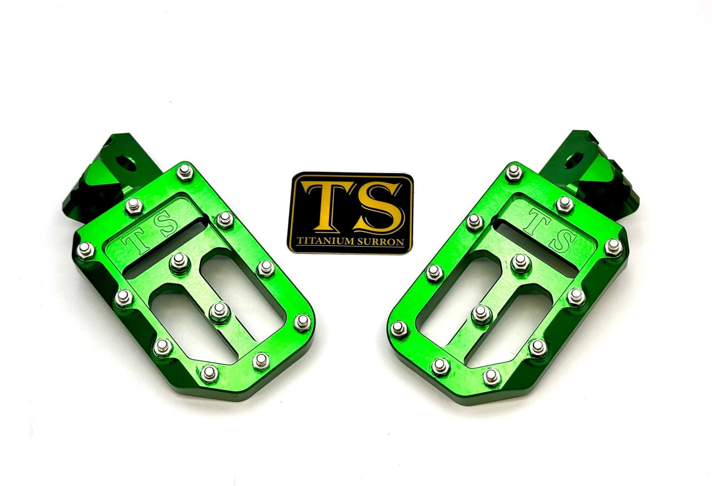 Titanium Surron custom foot pegs with titanium grips, designed for Surron and light e-moto bikes, featuring durable metal construction.