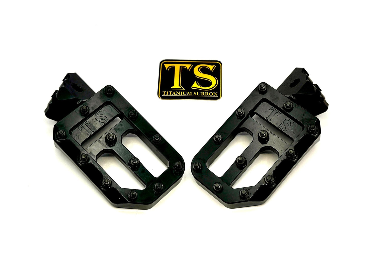 Titanium Surron custom foot pegs with titanium grips, designed for Surron, Talaria, and Altis light electric motorcycles.