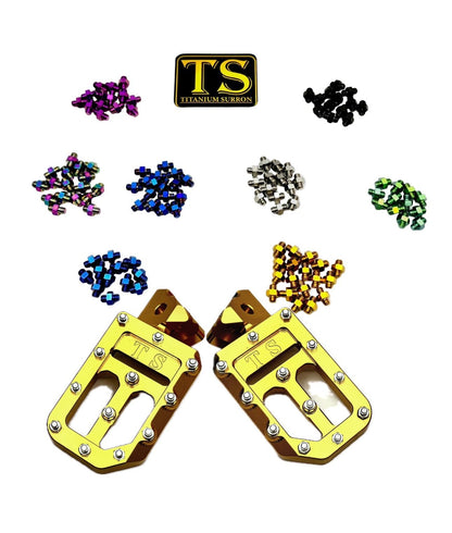 Titanium Surron custom foot pegs with titanium grips for Surron and light e-moto, showing sturdy metal construction and grip details.