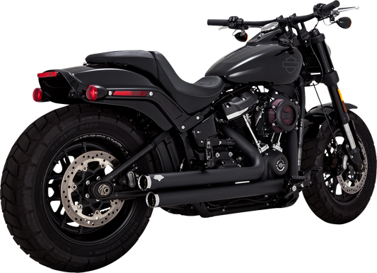 Vance & Hines Big Shots staggered motorcycle exhaust system with black finish, chrome accents, and mounting hardware visible.