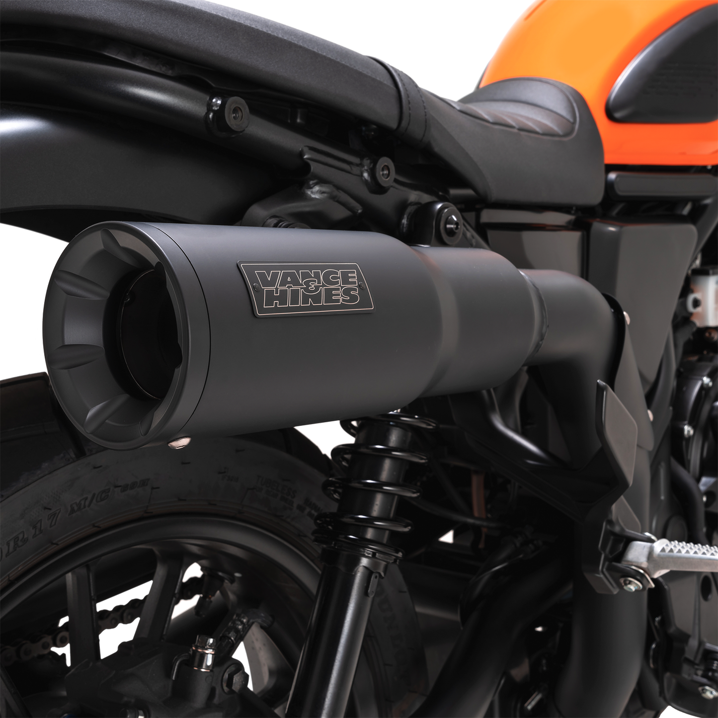 Vance & Hines Hi-Output Slip-On Muffler for motorcycles, showcasing the chrome finish and sleek exhaust design.