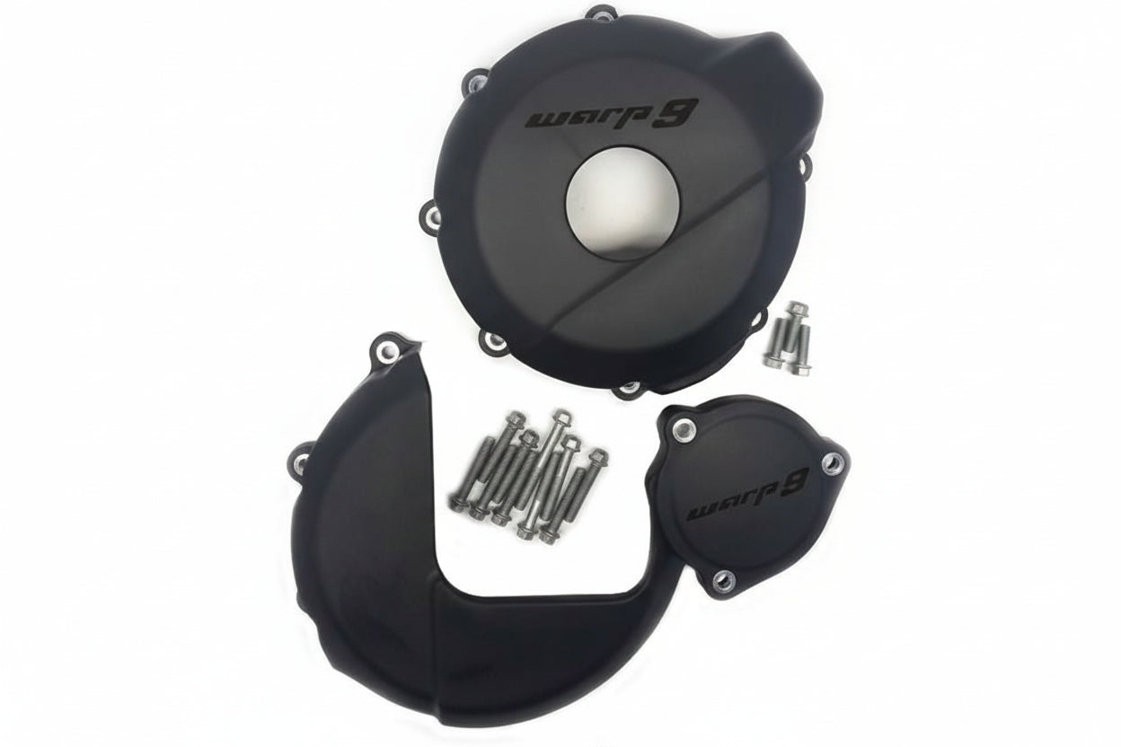 Suzuki DR650 engine case guards by Warp9Racing, black protective covers installed on motorcycle engine cases.