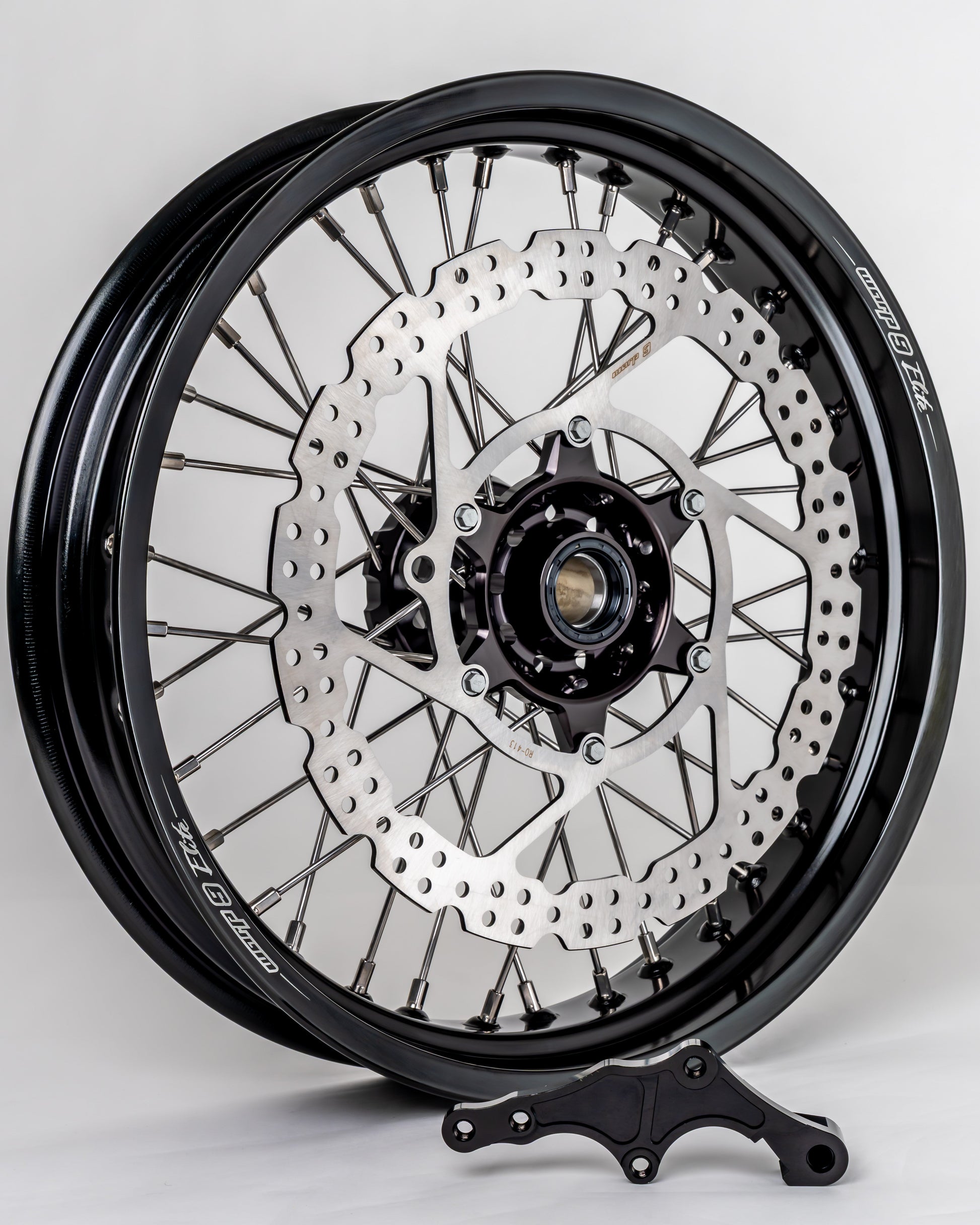 Black and silver Warp9Racing Braketec front 17-inch wheel for Husqvarna Gas Gas bikes, in stock with detailed fitment.
