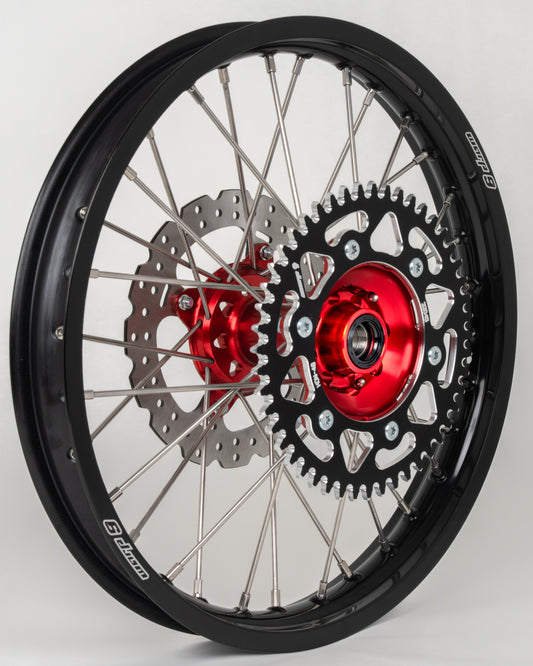 Warp9Racing rear wheel for early Honda CR/CRF bikes, featuring red, black, and silver design with 38T gear in stock.
