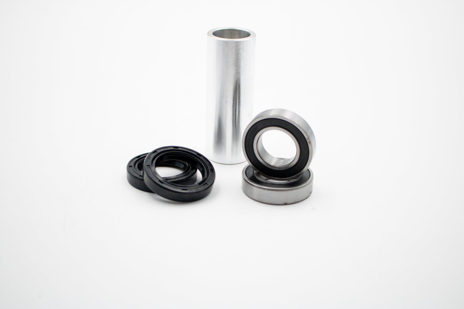 Honda CRF front wheel bearing kit by Warp9Racing, showing assembled bearings and hub components for motorcycle wheel rebuild.