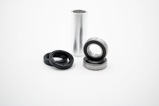 Honda CRF front wheel bearing kit by Warp9Racing, showing assembled bearings and hub components for motorcycle wheel rebuild.