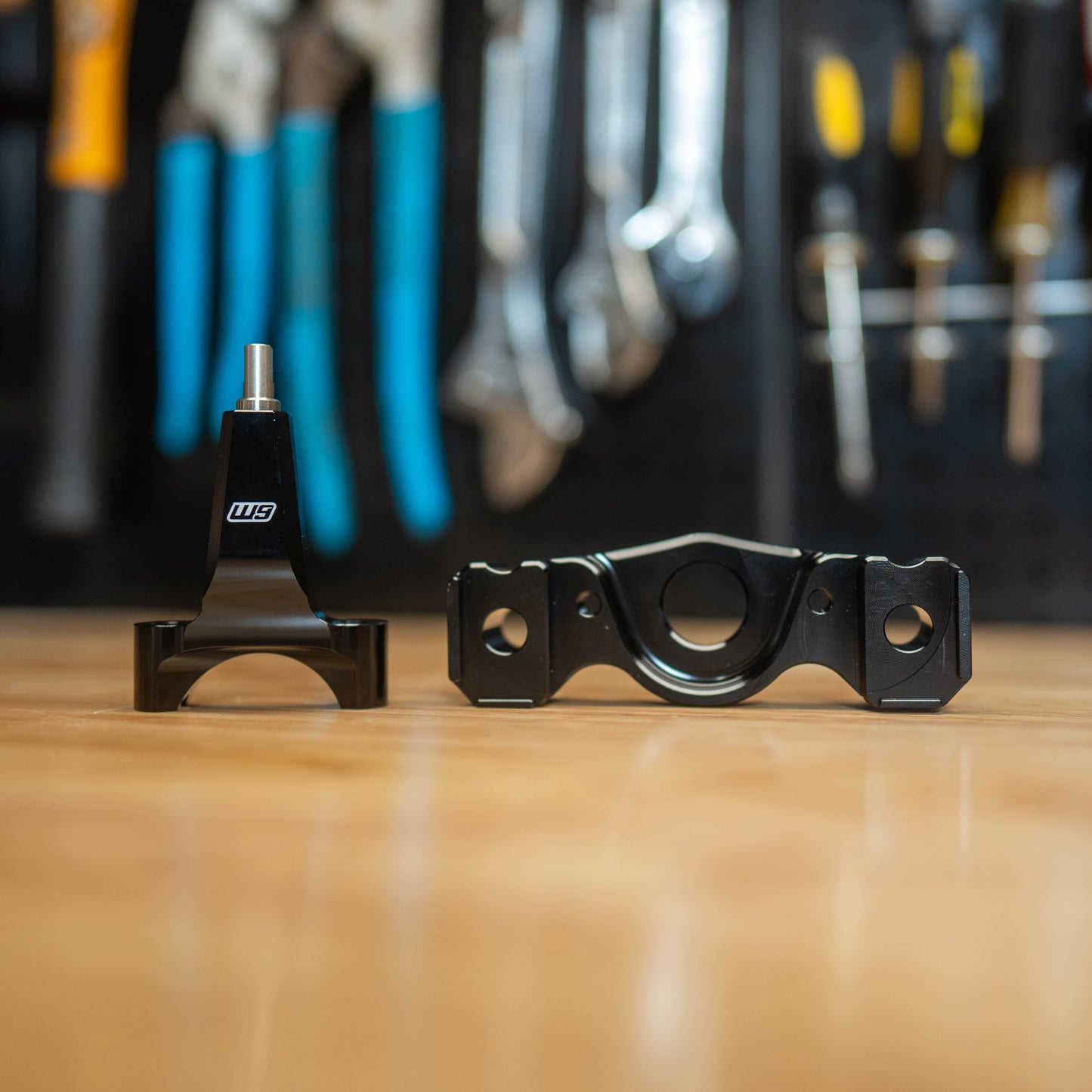 Warp9Racing Surron Ultra Bee Stabilizer Mount with Frame Post, black metal bike accessory attached to electric motorcycle frame.