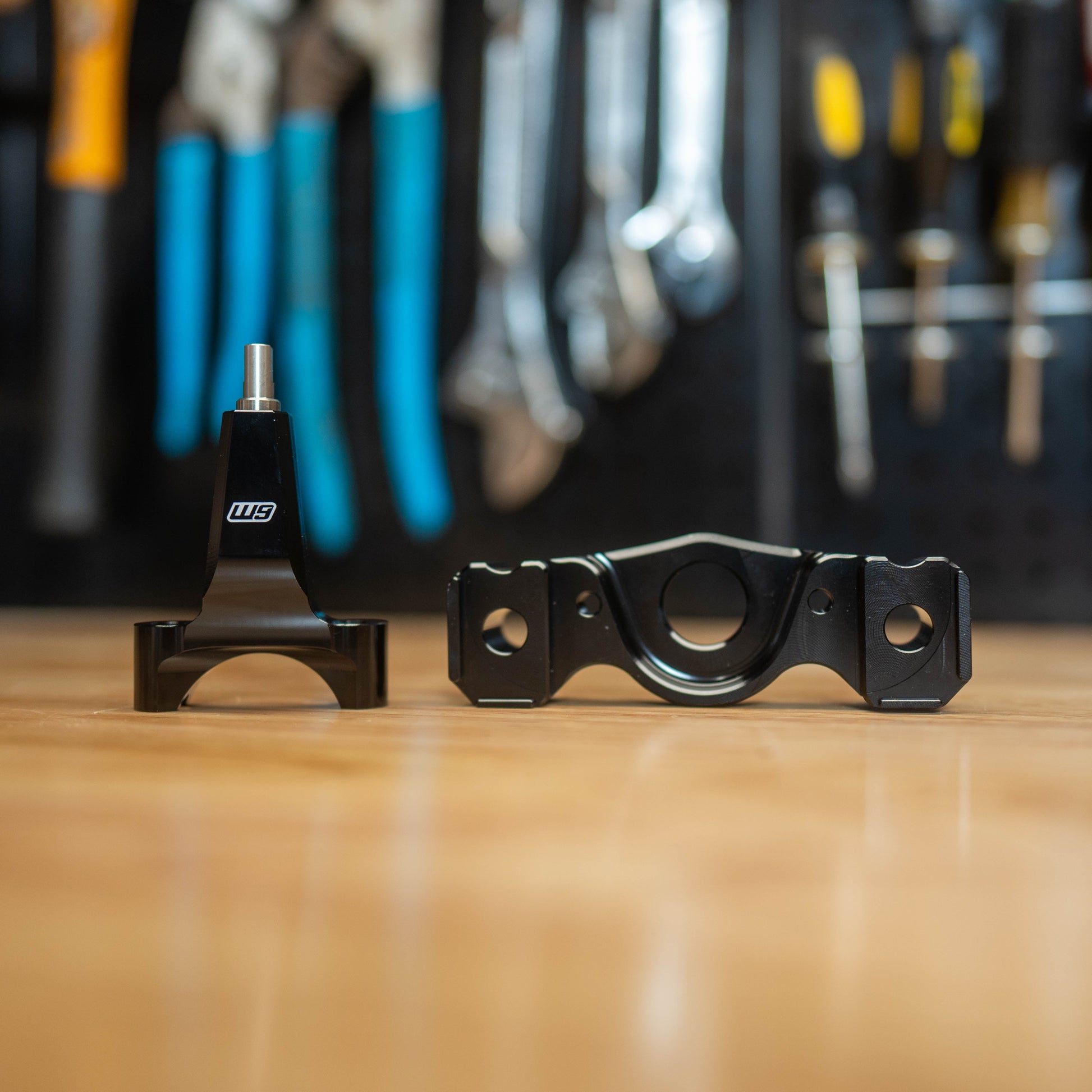 Warp9Racing Surron Ultra Bee Stabilizer Mount with Frame Post, black metal bike accessory attached to electric motorcycle frame.