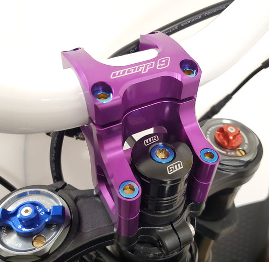 Warp 9 Racing titanium stem lock replacement bolt for e-moto steering stem upgrade, showcasing a sleek, durable titanium bolt.