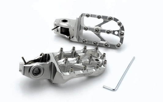 Warp9Racing silver Stark Varg Elite foot pegs for electric motorcycle, showcasing durable metal construction and secure mounting.