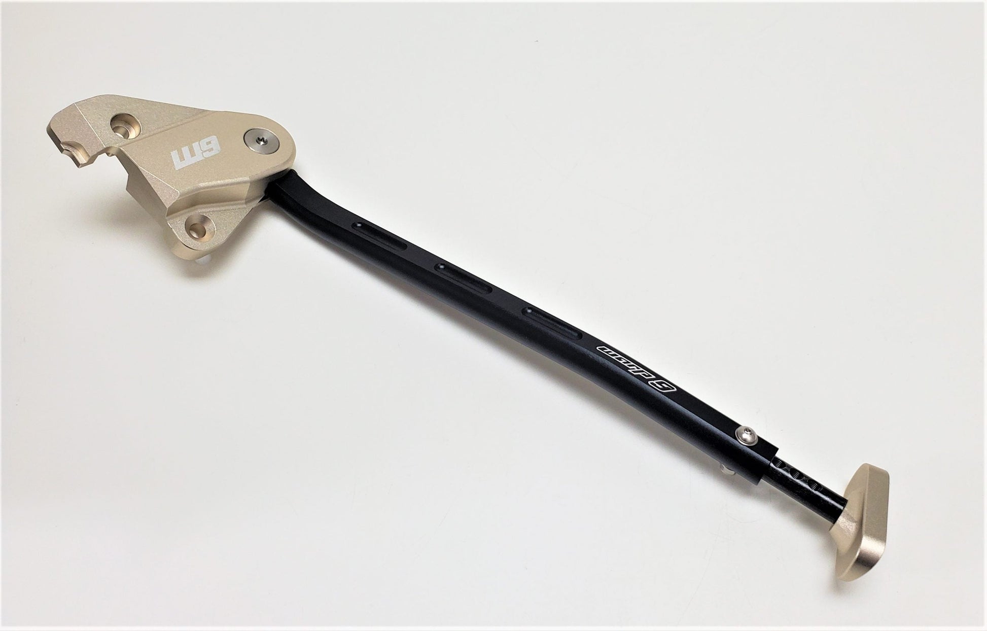 Adjustable Warp9Racing kickstand for KTM, Husqvarna, and GasGas motorcycles, featuring a sturdy design and easy installation.