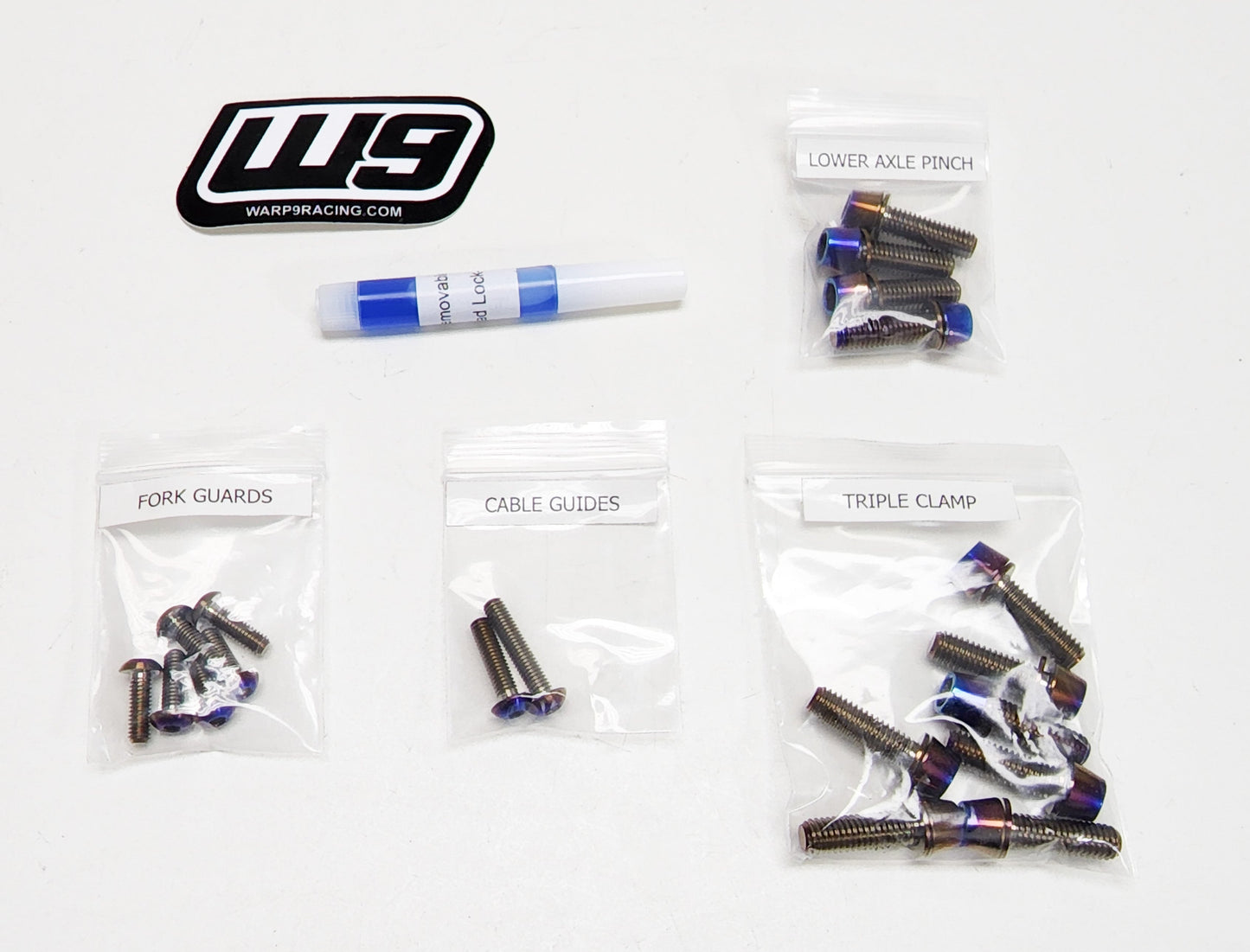 Titanium fork bolts for Surron and Talaria electric bikes by Warp9Racing, designed for Fox 40 suspension forks.