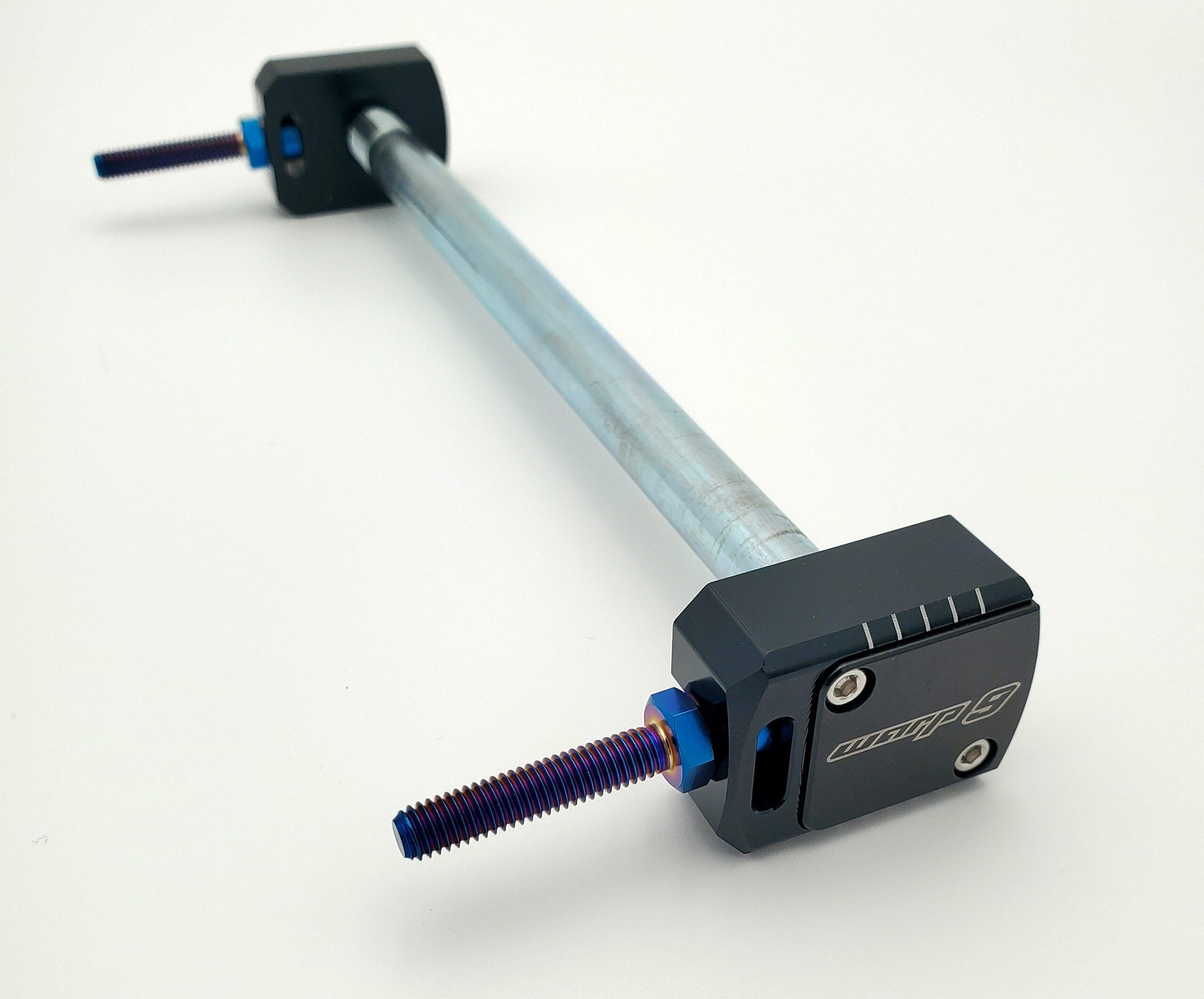 Warp9Racing Talaria Sting Lockdown Axle Blocks in steel, designed for secure wheel attachment on Talaria electric bikes.